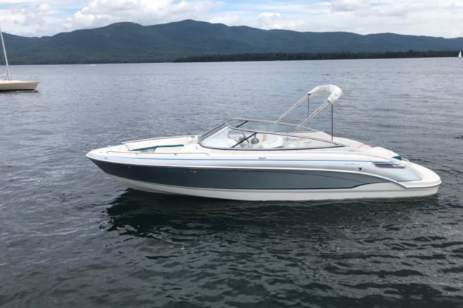 Picture of a gray and white 24 foot bowrider boat